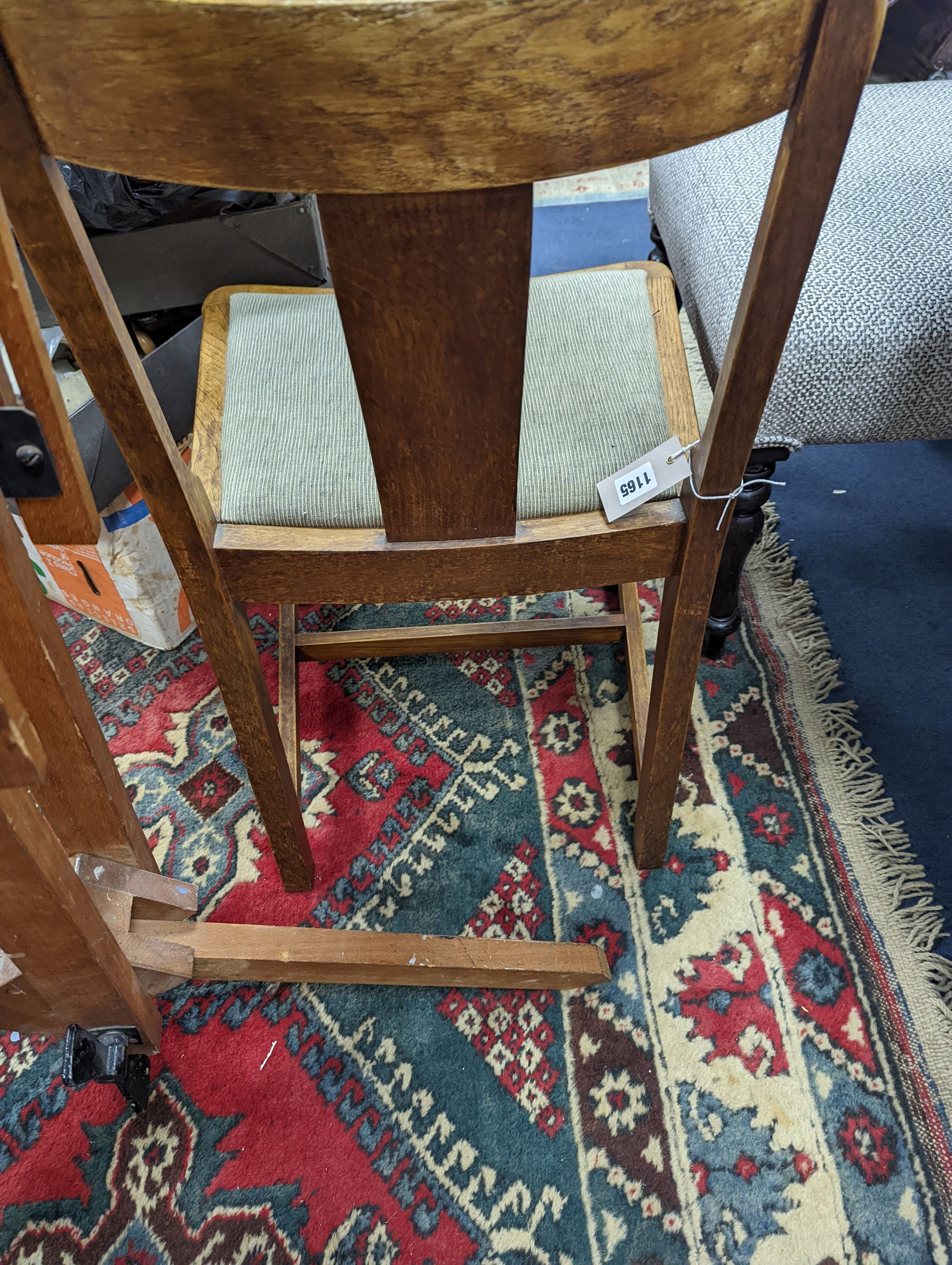 A pair of Arts and Crafts oak side chairs, outer Hebrides